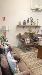 Comfortable waiting lounge with armchairs, cushions and Thai decor at Arokaya Wellness Spa Thai massage St Kilda