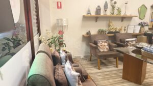 Relaxation waiting lounge with sofas, armchairs and Thai decor at Arokaya Wellness Spa Thai massage St Kilda