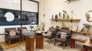 Front waiting lounge with armchairs by the shopfront windows at Arokaya Wellness Spa Thai massage St Kilda